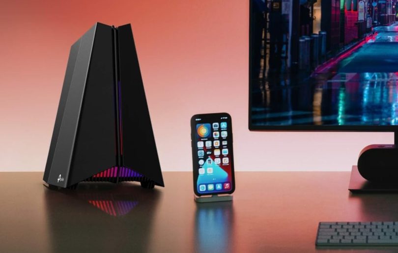 Routeur gaming WiFi 7 TP-Link Archer GE550 avec éclairage RGB posé sur un bureau à côté d’un smartphone