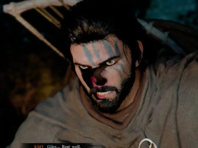 Capture d'écran du jeu Crimson Desert : plan rapproché sur le visage d'un personnage (Kliff) montrant des bugs de texture prononcés (pixels noirs et décolorations) sur le nez et les yeux, illustrant les problèmes de rendu sur les GPU Intel Arc avant les correctifs. Les sous-titres en bas affichent "Kliff Giles... Rest well."