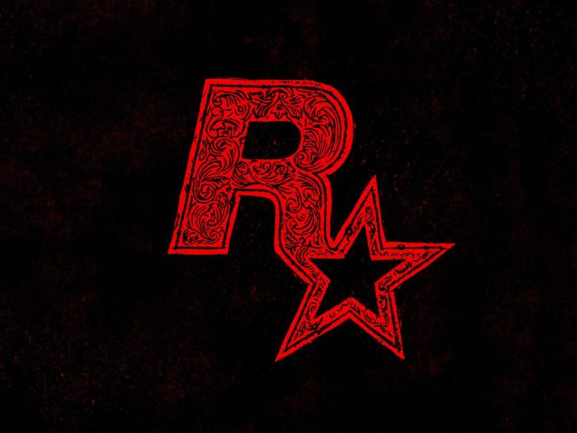 Logo rouge stylisé de Rockstar Games avec des motifs ornementaux baroques sur fond noir, illustrant les tensions internes liées au développement de GTA 6.