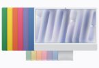 Le nouvel iMac 24 pouces avec puce M6 vu de face, devant les sept coloris de la gamme (vert, jaune, orange, rose, violet, bleu et argent) disposés en éventail