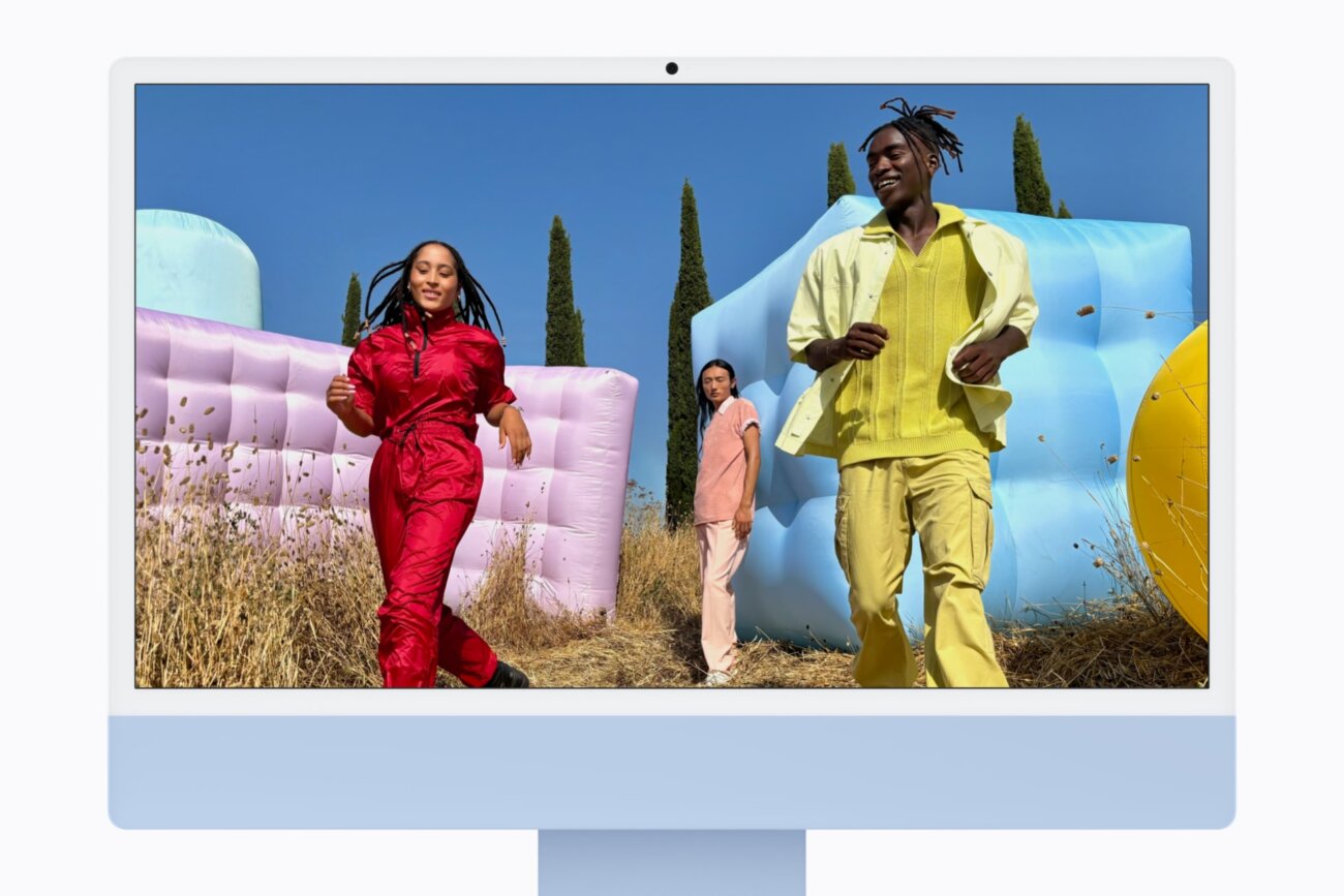 iMac M6 bleu vu de face affichant une photo colorée sur son écran Retina 4,5K de 24 pouces