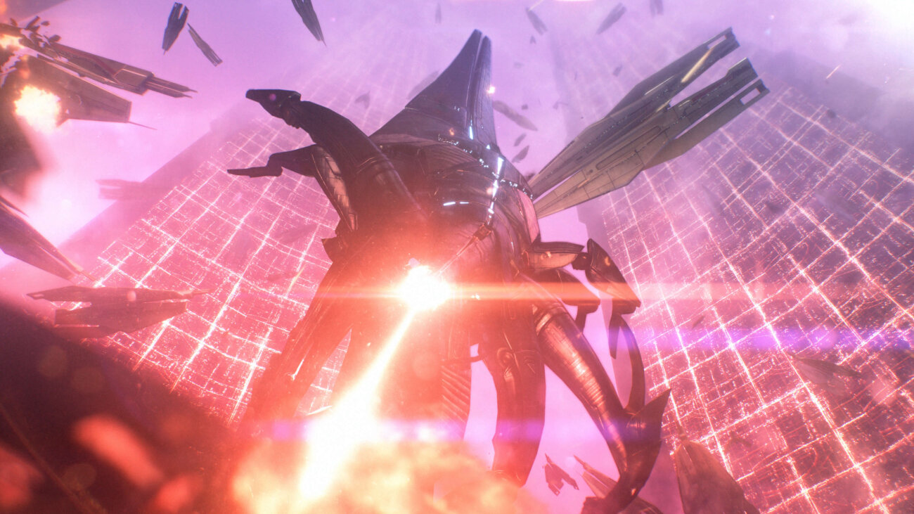 Capture d'écran officielle de Mass Effect Édition Légendaire montrant un Moissonneur géant tirant son rayon rouge au cœur d'un champ de bataille
