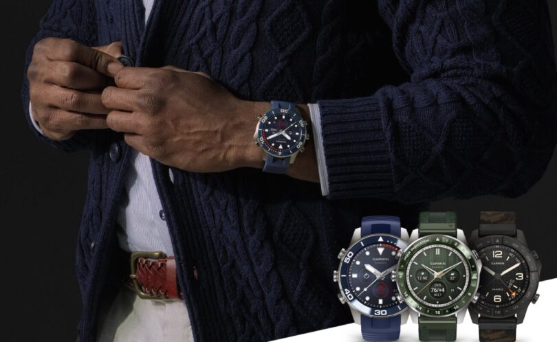 Homme en gilet de laine portant une Garmin MARQ Diver (Gen 3) à lunette bleue, à côté de trois autres montres MARQ (Gen 3) en titane avec bracelets bleu, vert et camouflage