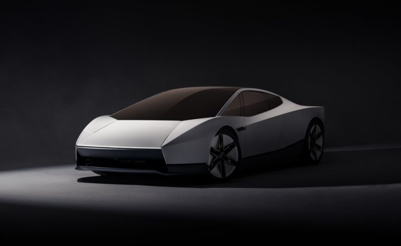 Nouveau Tesla Roadster présenté le 15 octobre 2026, vu de trois quarts avant en peinture blanche, avec phares dissimulés et ligne de coupé deux places