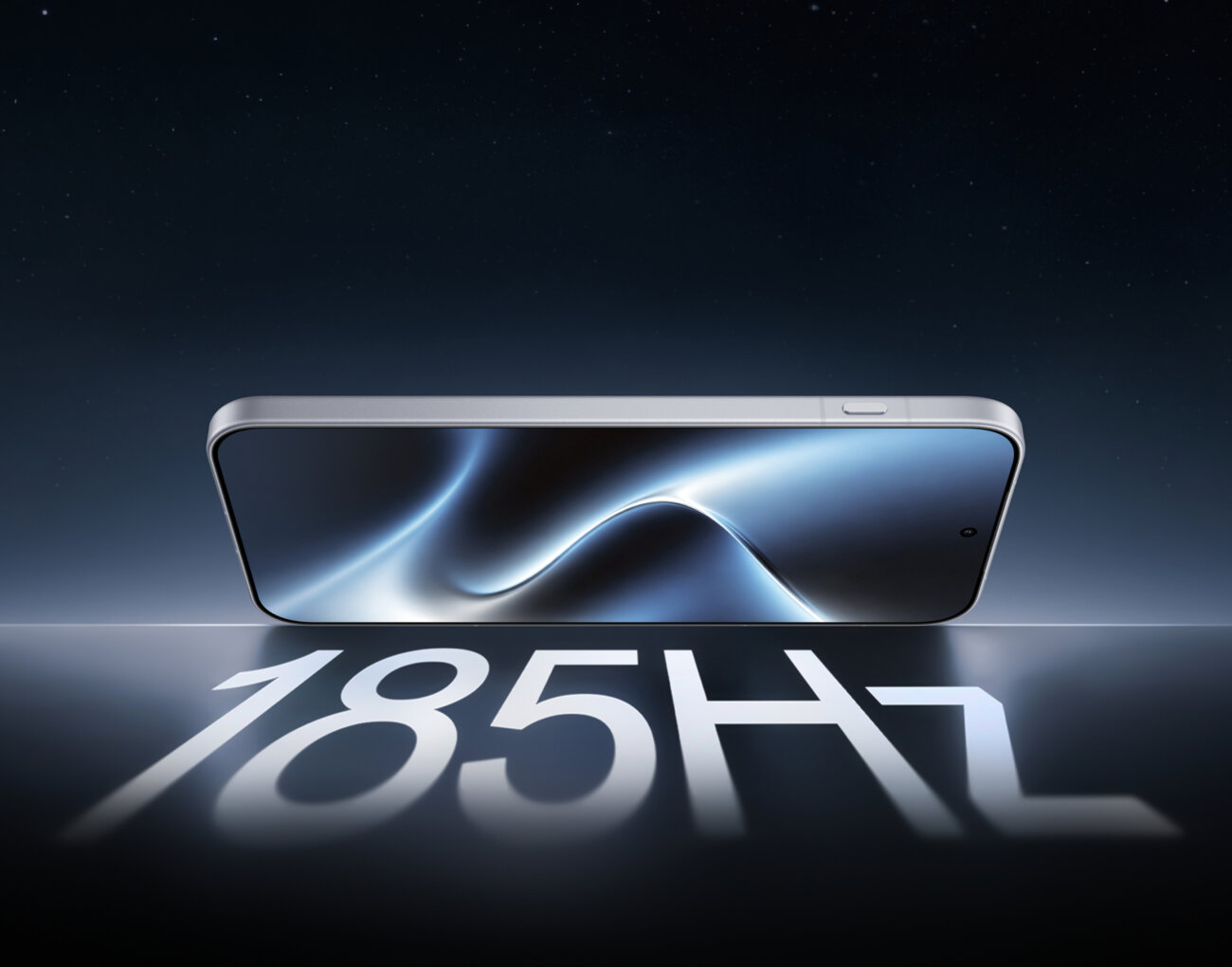 OnePlus 16 posé à plat, écran allumé, au-dessus de l'inscription 185Hz qui rappelle la fréquence de rafraîchissement maximale de son écran OLED