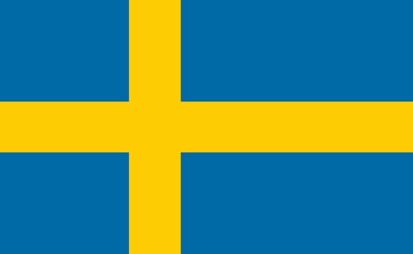 Drapeau de la Suède, croix scandinave jaune sur fond bleu, illustration de la décision du gouvernement suédois de bloquer ChatGPT et Claude sur les postes de ses ministères